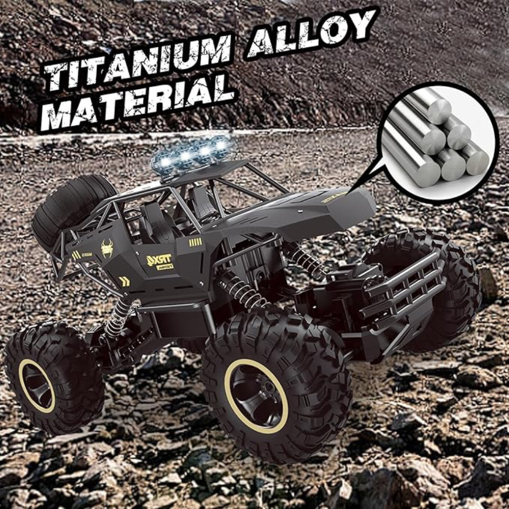 I YAN 4WD RC rock crawler truck with LED headlights and two batteries, shown on rough terrain with detailed chassis and large tires.