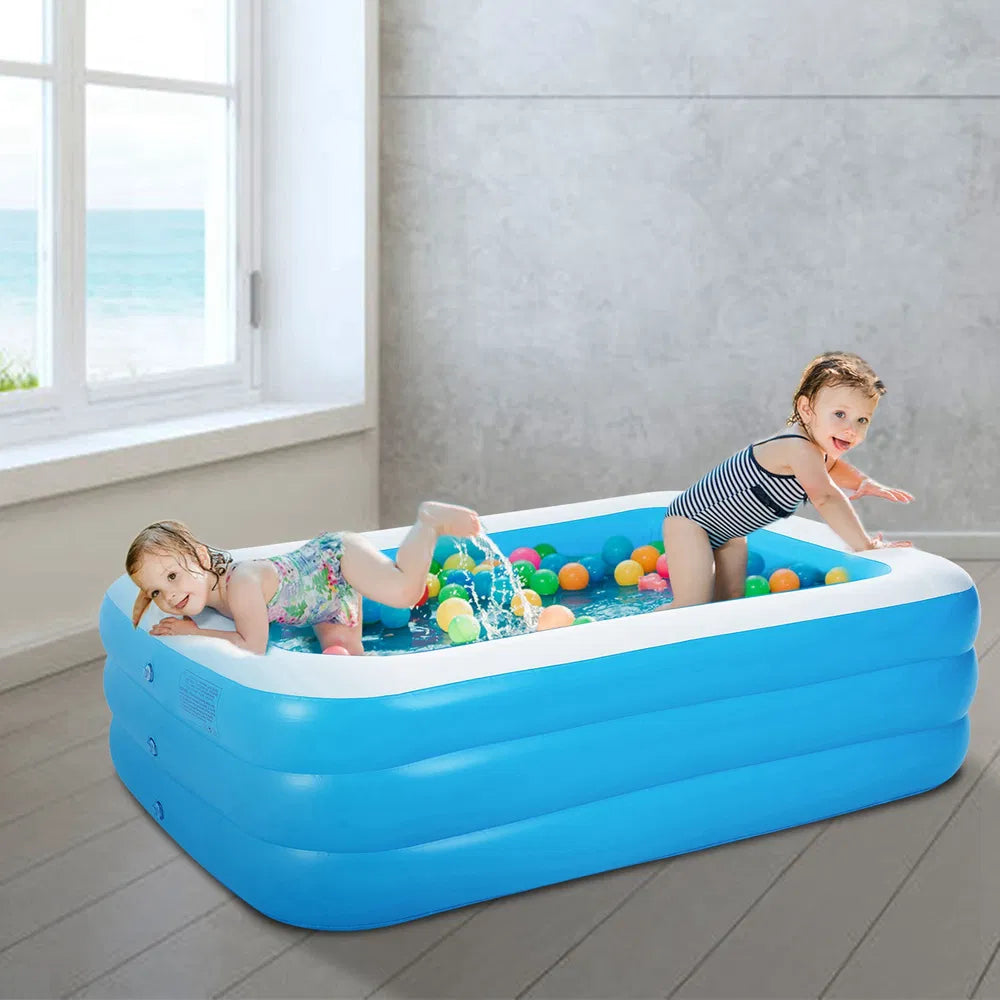 Large inflatable family swimming pool by I YAN, 120x72 inches, suitable for kids and adults, filled with water and set up outdoors.