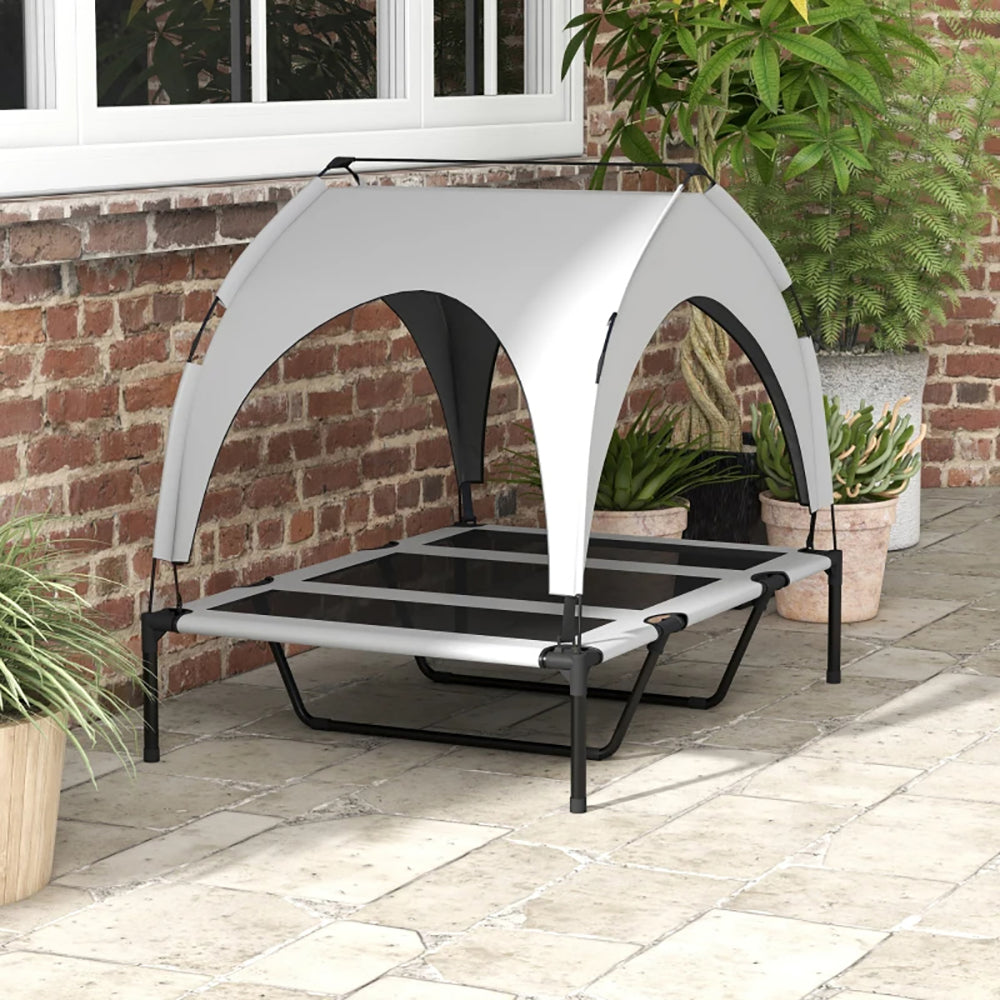 Raised outdoor dog bed with canopy for large dogs, I YAN brand, featuring a sturdy frame and shaded sleeping area.