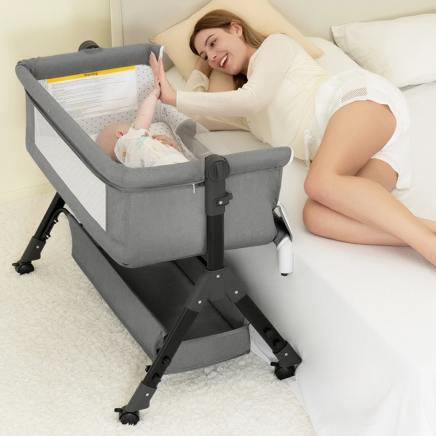 Portable 3-in-1 Baby Bassinet Bedside Sleeper by I YAN, easy to assemble and fold, suitable for newborns, lightweight and foldable design.