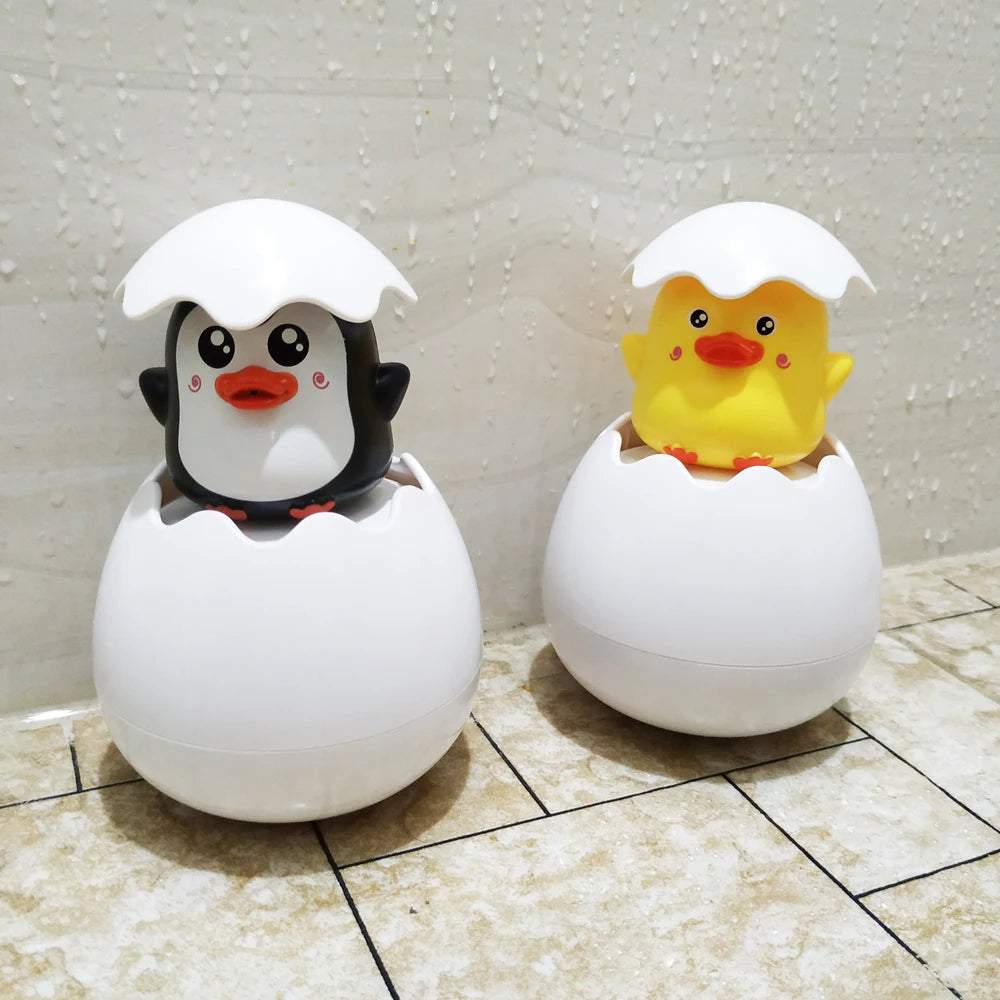 Baby bath toy featuring a cute duck and penguin water spray sprinkler by I YAN for kids' bath time fun.