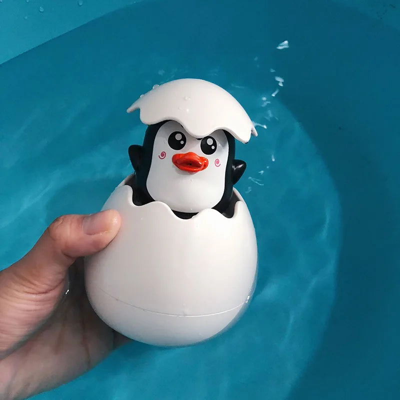 Baby bath toy set with cute duck and penguin water spray sprinklers for kids, featuring colorful, waterproof plastic figures by I YAN.