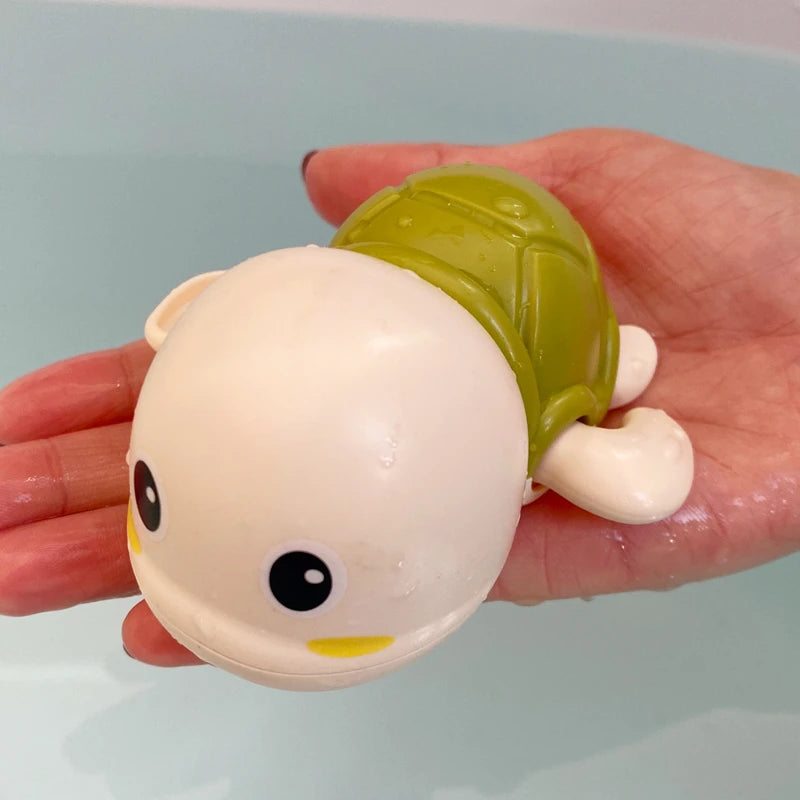 Baby bath toy featuring a cute duck and penguin water spray sprinkler for kids, from I YAN, designed for bath time fun.