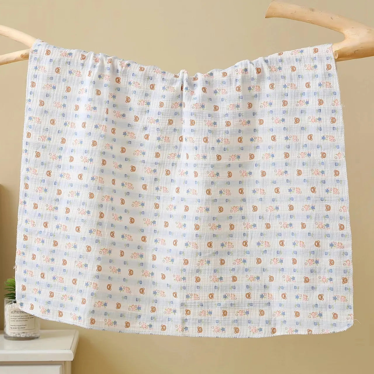 Soft cotton muslin baby swaddle blanket with cute cartoon print, breathable and gentle for newborns by I YAN.