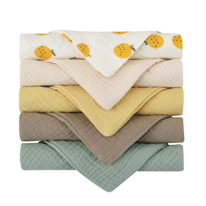Set of five soft, absorbent cotton baby face towels and burp cloths with square design, ideal for feeding and cleaning.