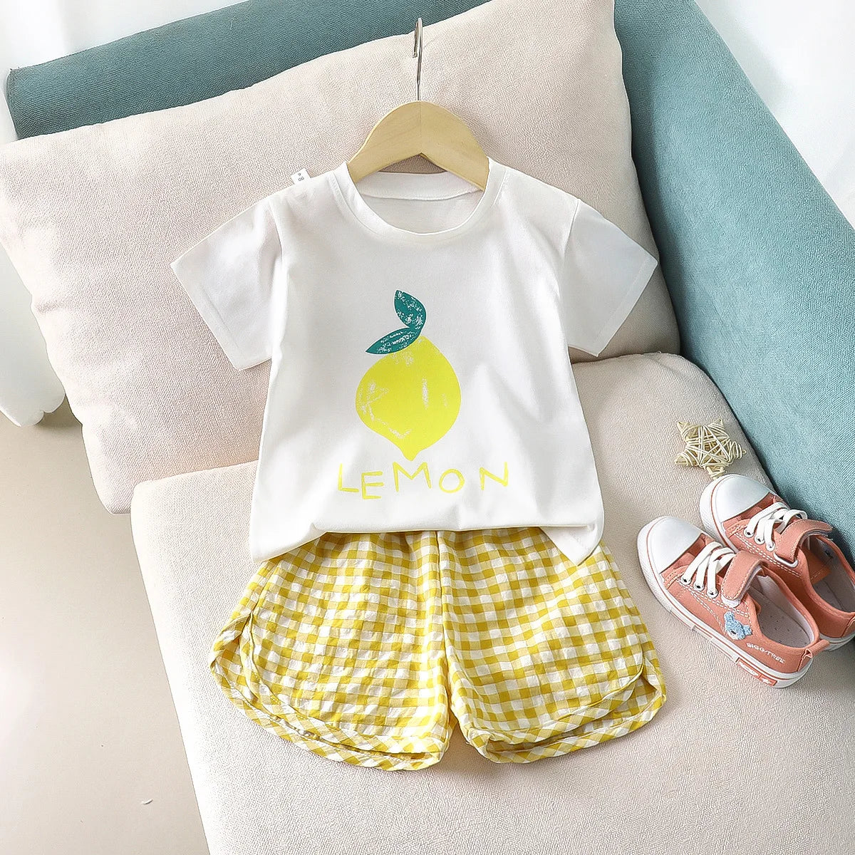 Children's 2-piece summer set by I YAN featuring a cartoon lemon and grape top with plaid shorts, casual and colorful for kids.