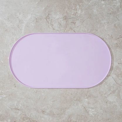Non-slip waterproof silicone pet feeding mat for cats and dogs, designed to keep food and water spills contained.