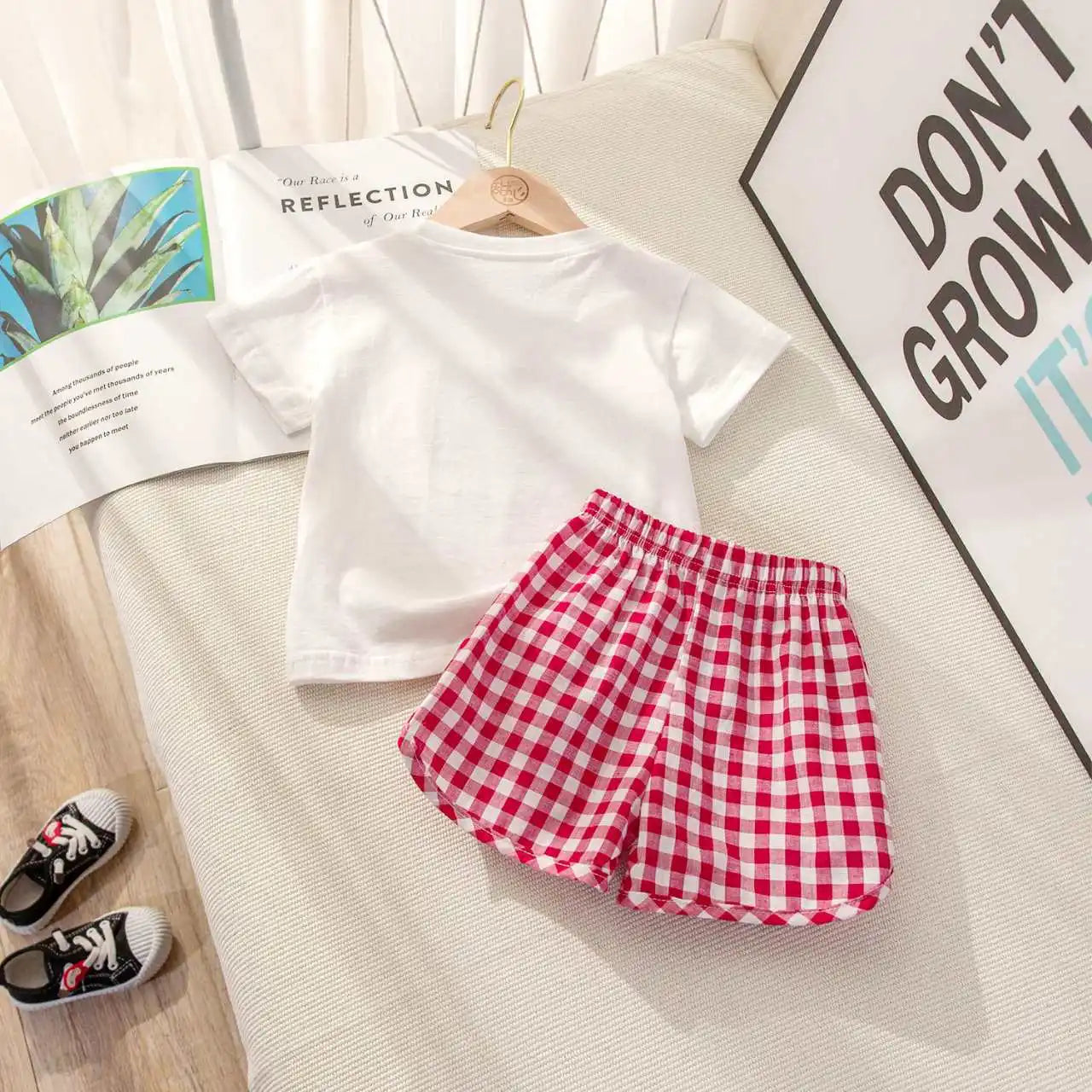 Children's casual summer set by I YAN featuring a short-sleeved top and plaid shorts with lemon and grape cartoon prints.
