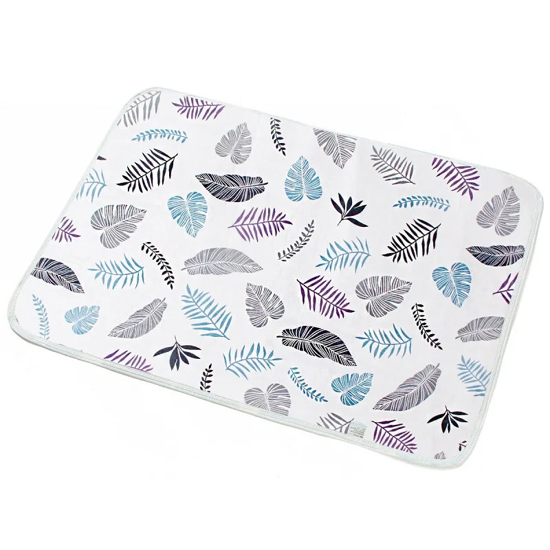I YAN waterproof baby changing pad cover on a baby bed mat, reusable diaper pad protector with soft, waterproof fabric for infants.