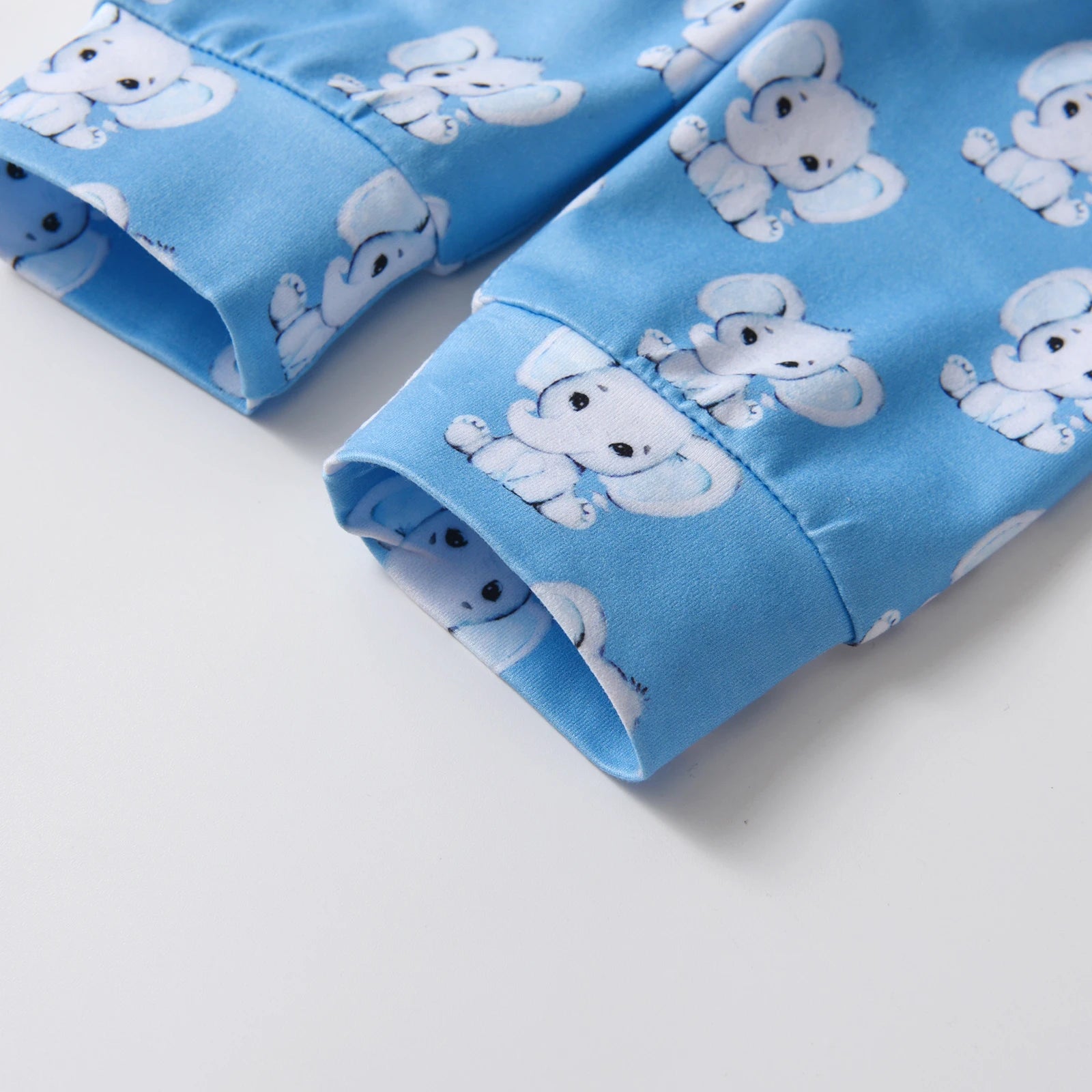Newborn baby boy outfit by I YAN featuring a long sleeve romper with cartoon elephant print, matching pants and hat set.