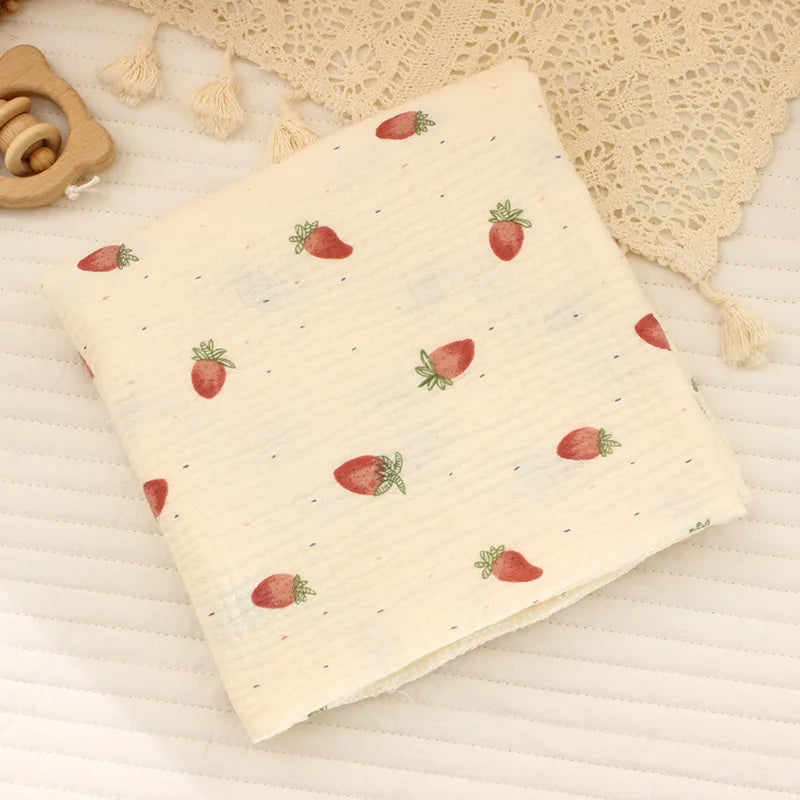 Soft cotton muslin baby swaddle blanket with cute cartoon print by I YAN, breathable and gentle for newborns.