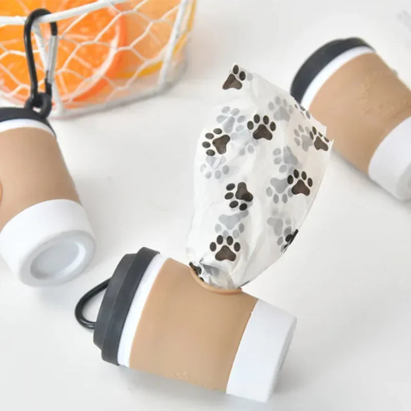 Portable pet poop trash can dispenser by I YAN with a creative coffee cup design for outdoor dog walking garbage bag storage.