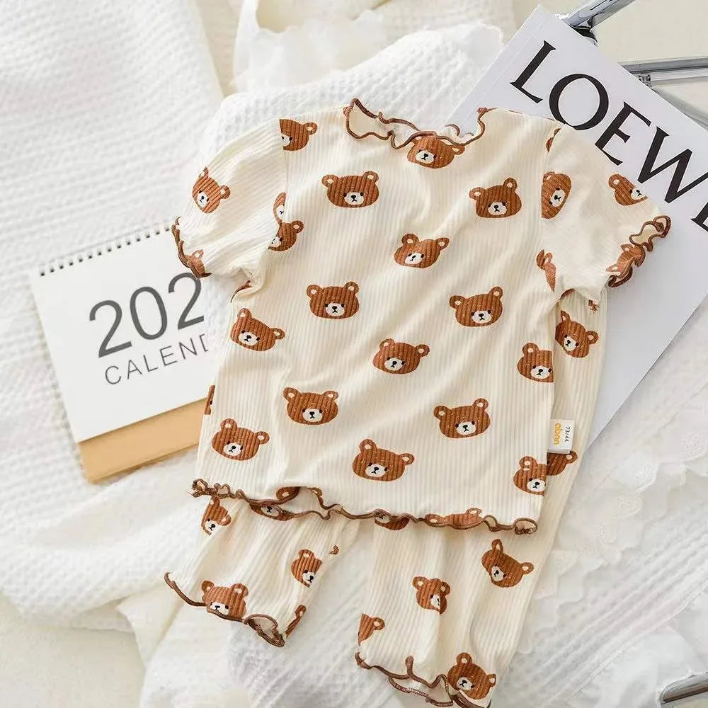I YAN kids' summer 2-piece set featuring a floral printed short sleeve T-shirt and matching pants for casual home wear.
