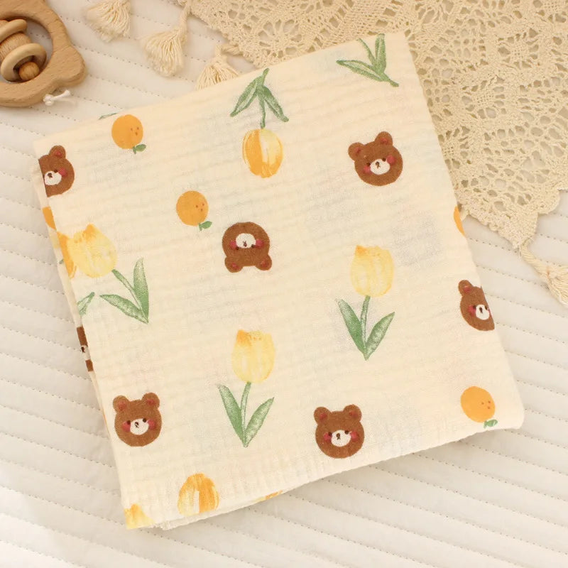 Soft cotton muslin baby swaddle blanket with cute cartoon print from I YAN, breathable and gentle for newborn boys and girls.