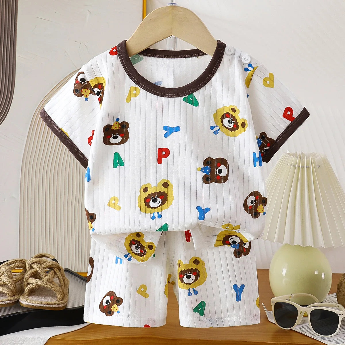 Two-piece children's clothing set by I YAN featuring a cotton T-shirt and shorts for girls and boys, perfect for summer.