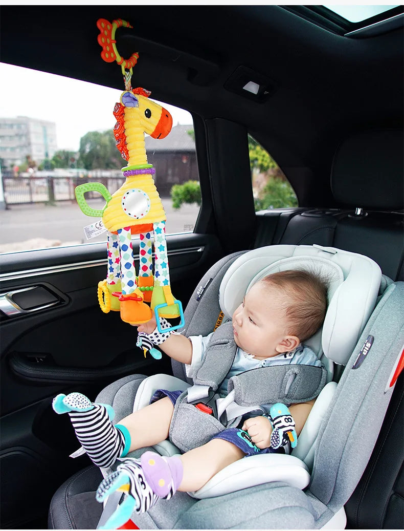 Soft giraffe and zebra plush handbells with rattles and teether for infants, suitable for newborns and baby development.
