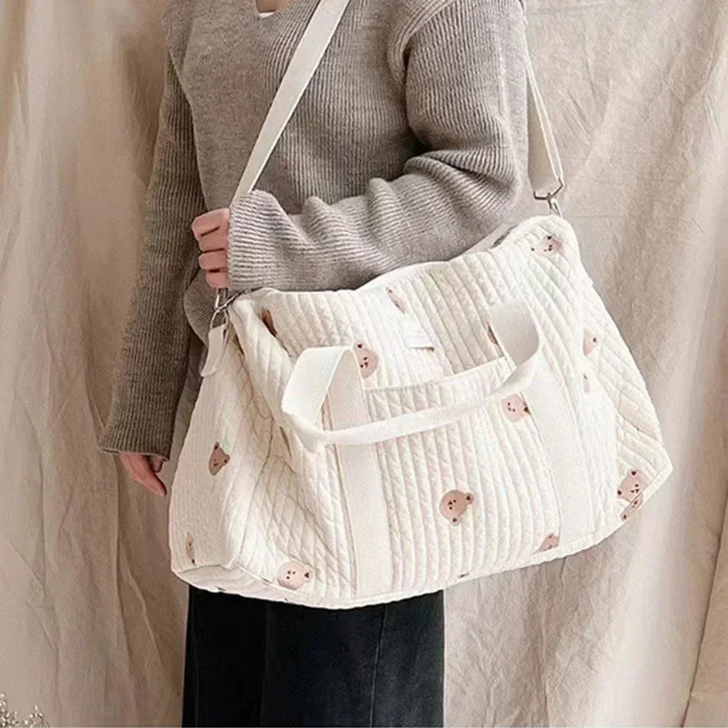 I YAN Mommy Bear Maternity Diaper Bag with stroller straps, portable changing organizer, and spacious tote for travel and baby care.
