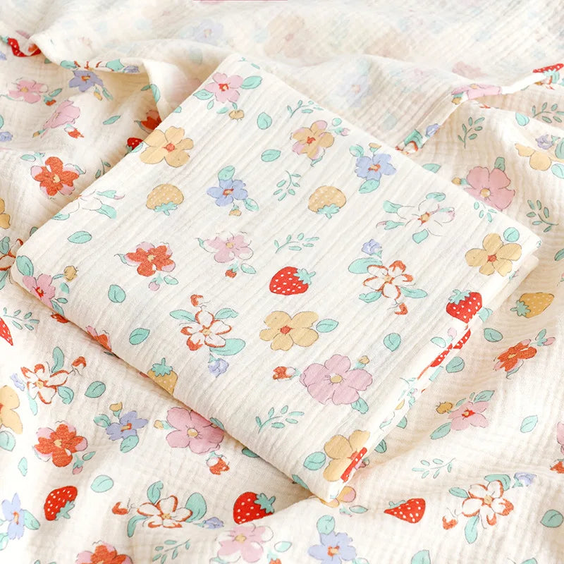 Soft cotton muslin baby swaddle blanket with cute cartoon print by I YAN, breathable and gentle for newborn boys and girls.