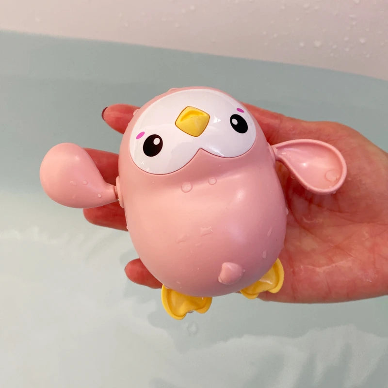 Baby bath toy featuring a cute duck and penguin water spray sprinkler by I YAN for kids, perfect for bath time fun