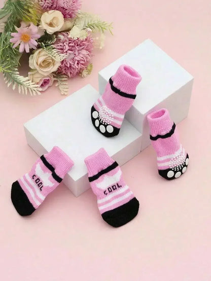 Set of four cute anti-slip dog socks with paw protectors for small dogs, featuring non-slip soles for added safety.