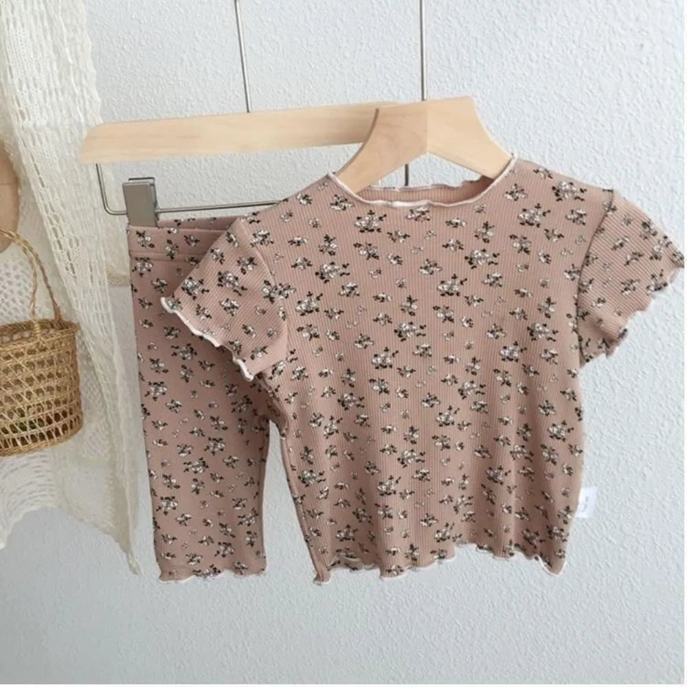 Kids' summer casual 2-piece set by I YAN with floral printed short sleeve T-shirt and matching pants, perfect for home wear.