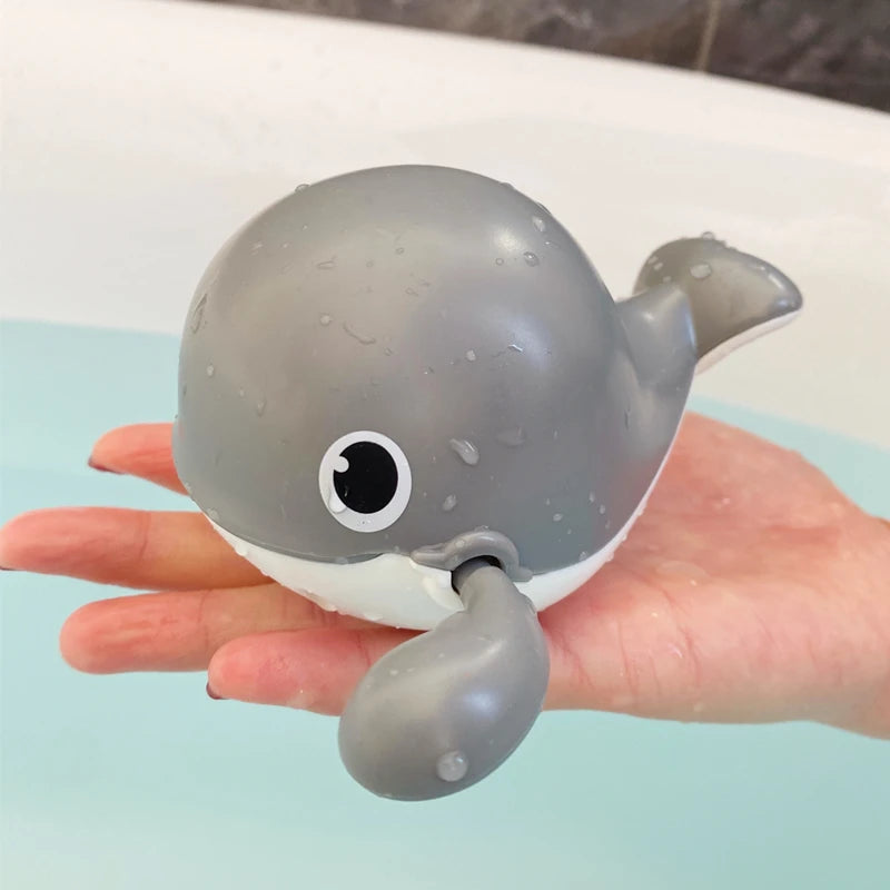 Baby bath toy featuring a cute duck and penguin water spray sprinkler by I YAN, designed for kids' bath fun.