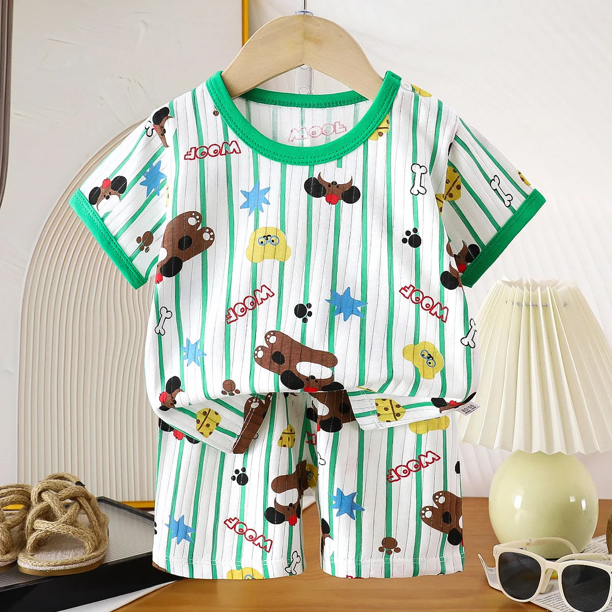 Two-piece children's clothing set by I YAN featuring a cotton T-shirt and shorts for girls and boys, perfect for summer wear.