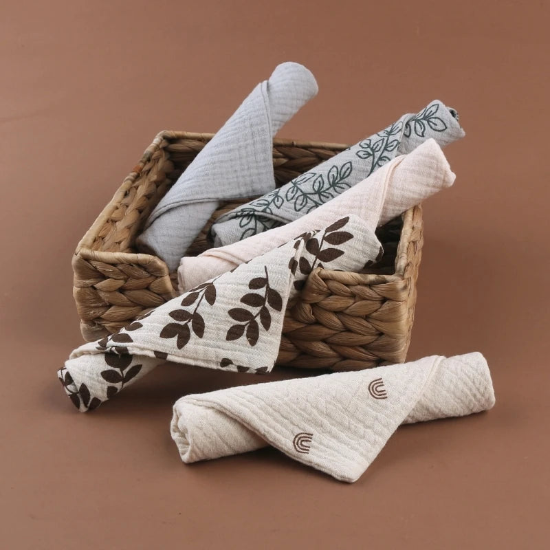 Set of five I YAN square cotton baby face towels and burp cloths with soft, absorbent gauze fabric for babies and kids.