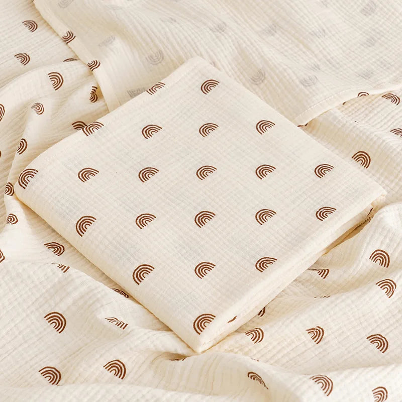 Soft cotton muslin baby swaddle blanket with colorful cartoon print, breathable and gentle for newborns by I YAN.