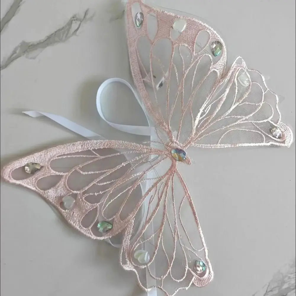 Dog and cat with I YAN butterfly wings pet costume, featuring colorful butterfly wing back decoration for pets.