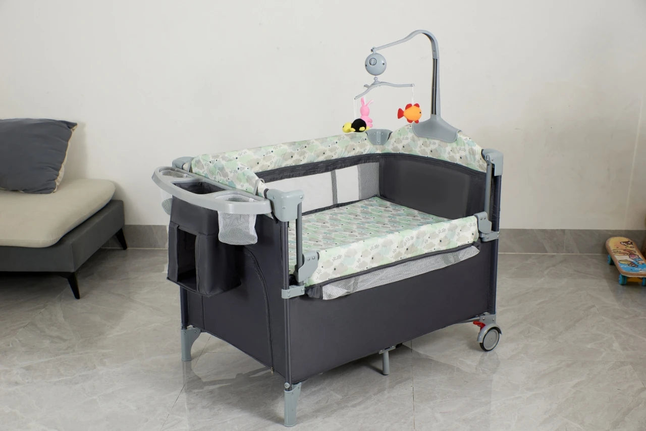 I YAN Pack n Play infant playard with bassinet, changing table, lockable wheels, music box, and foldable design for easy use.