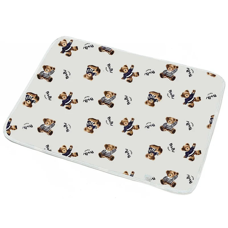 I YAN waterproof baby changing pad cover on a travel mattress, soft, reusable, and designed for diaper pad protection.