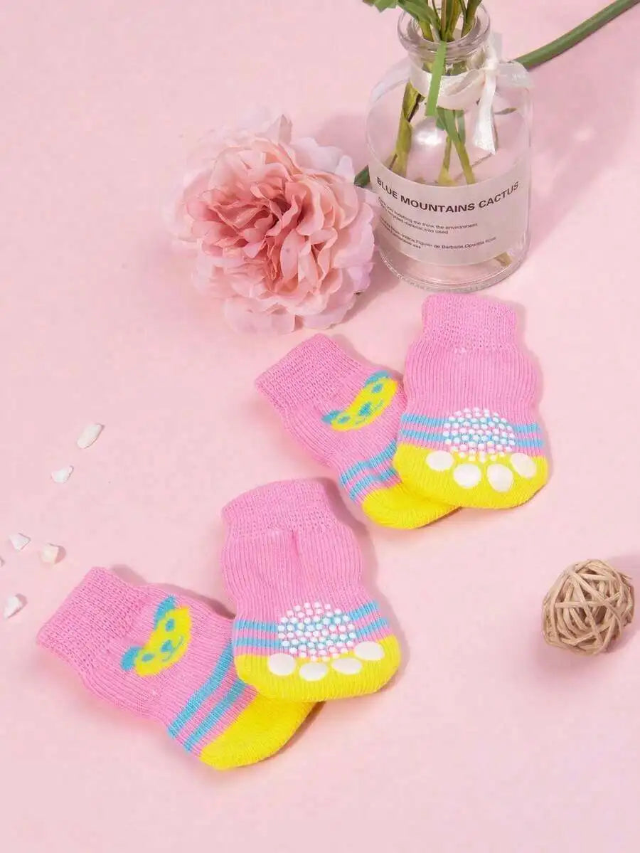 Set of four Cute Anti-Slip Dog Socks by I YAN with paw protectors, designed for small dogs to prevent slipping and protect paws.