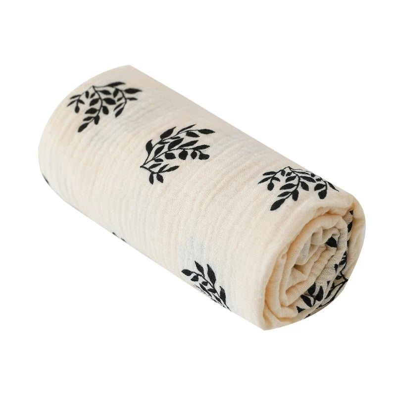 Soft cotton swaddle blanket for babies by I YAN, featuring solid color and floral print on crinkle muslin fabric.