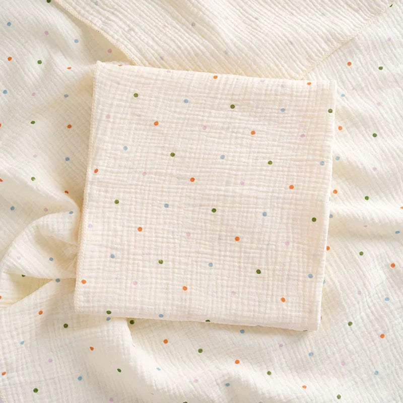 Soft cotton muslin baby swaddle blanket with cute cartoon print by I YAN, breathable and gentle for newborn boys and girls.