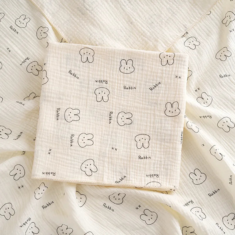 Soft cotton muslin baby swaddle blanket by I YAN with cute cartoon print, breathable and gentle for newborn boys and girls.