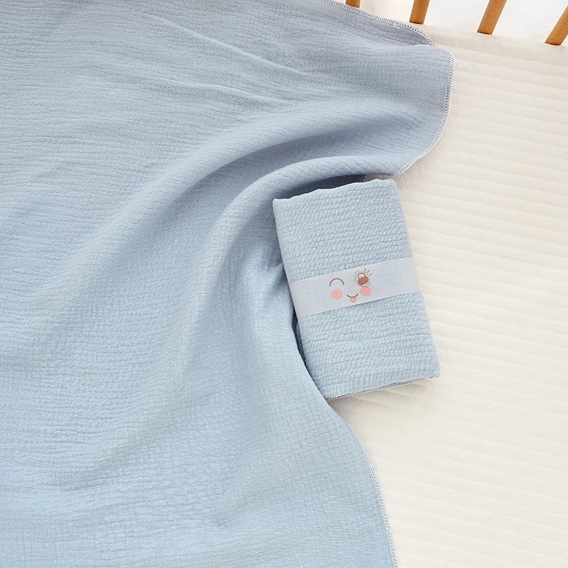 Soft cotton muslin baby swaddle blanket with cute cartoon print, breathable and gentle for newborns by I YAN.