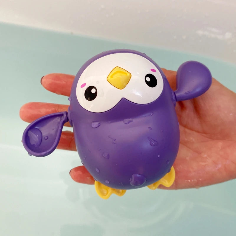 Baby bath toy featuring a cute duck and penguin water spray sprinkler for kids, by I YAN, ideal for bath time fun