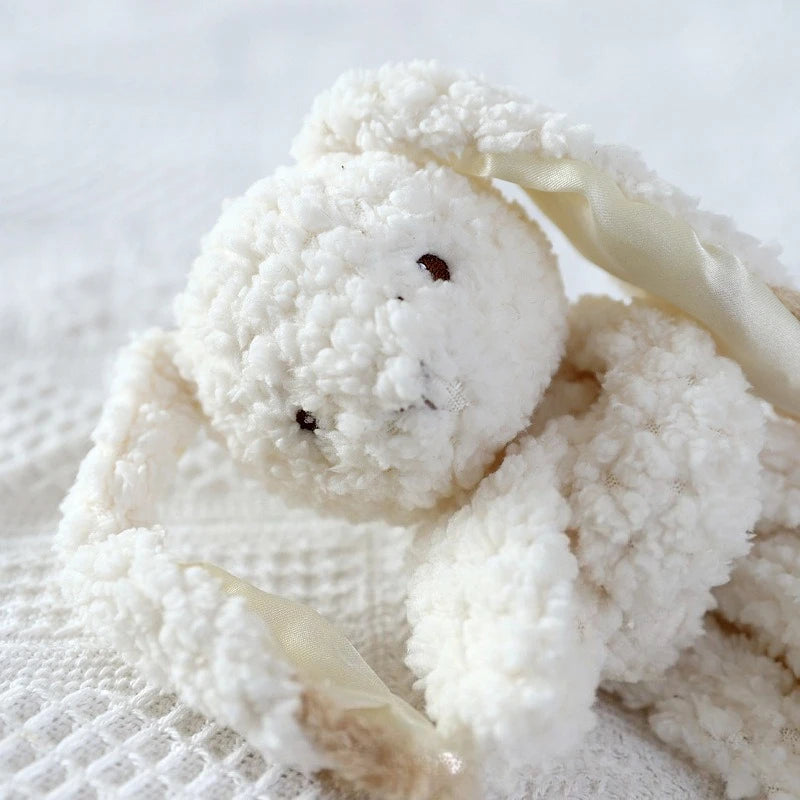 Organic cotton personalized baby burp cloth with cute rabbit embroidery and embroidered name, soft and soothing for newborns.