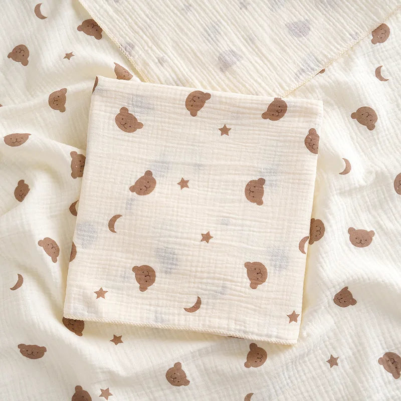 Soft cotton muslin baby swaddle blanket with cute cartoon prints, breathable and gentle for newborns by I YAN.