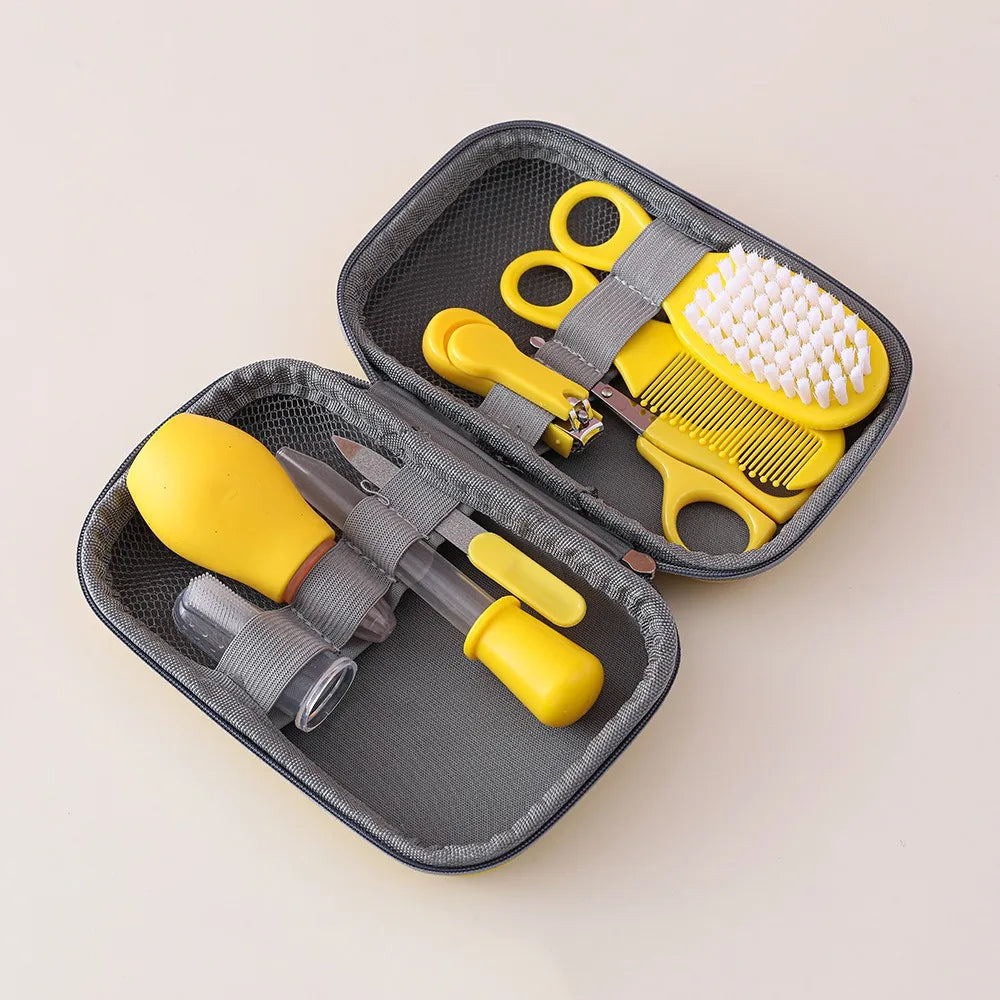 I YAN 8-piece baby healthcare and grooming kit including hairbrush, comb, nail clippers, scissors, toothbrush, and nasal aspirator.