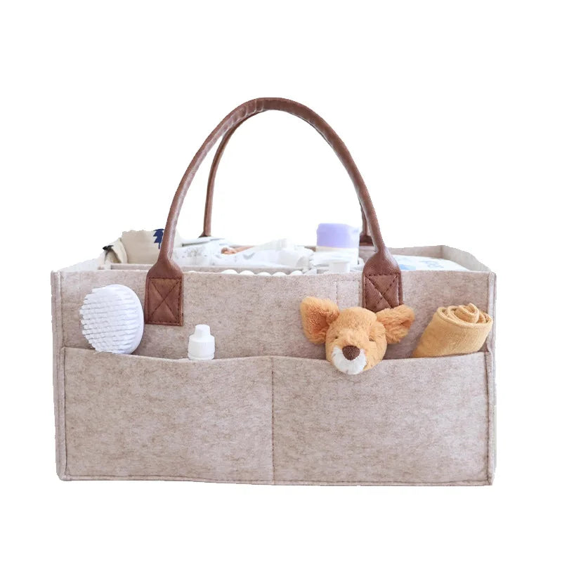 Baby felt nursery organizer basket with handle, large pocket, and storage compartments by I YAN for diapering and nursery organization.