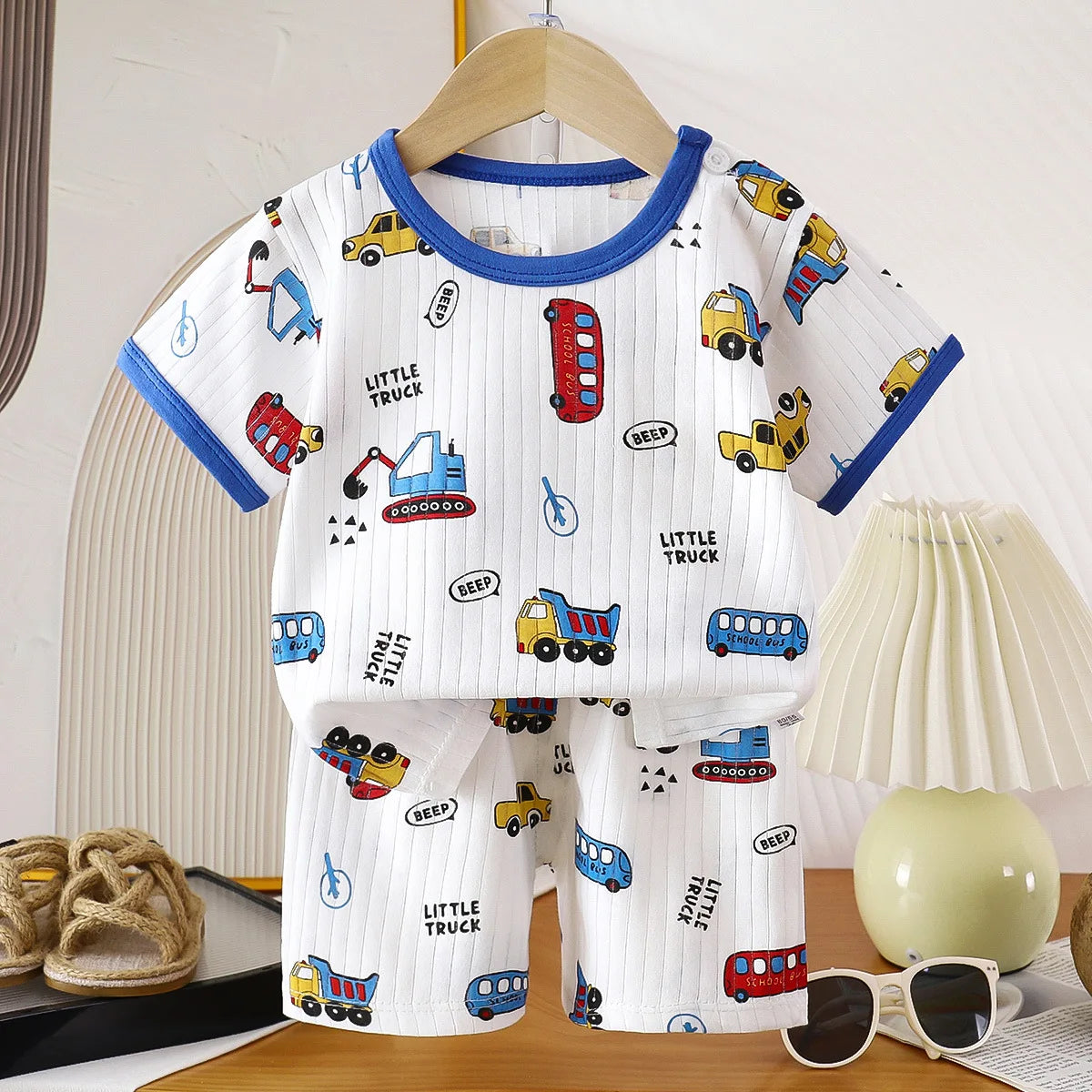 Two-piece children's clothing set by I YAN featuring a summer cotton T-shirt and shorts for girls and boys.