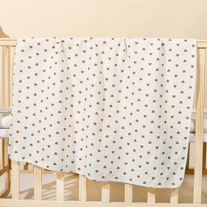 Soft cotton muslin baby swaddle blanket with cute cartoon print, breathable and gentle for newborn boys and girls by I YAN.