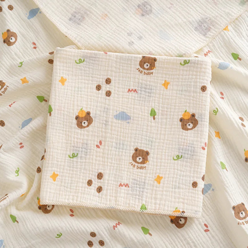 Soft cotton muslin baby swaddle blanket with cute cartoon print from I YAN, breathable and gentle for newborns and infants.
