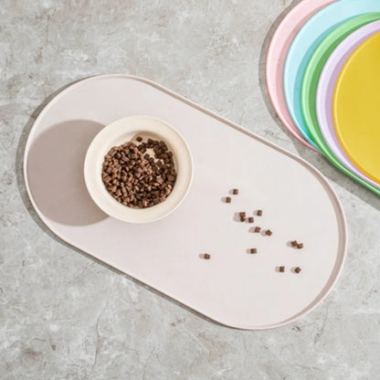 Non-slip waterproof silicone pet feeding mat for cats and dogs, designed to catch spills and keep feeding area clean.