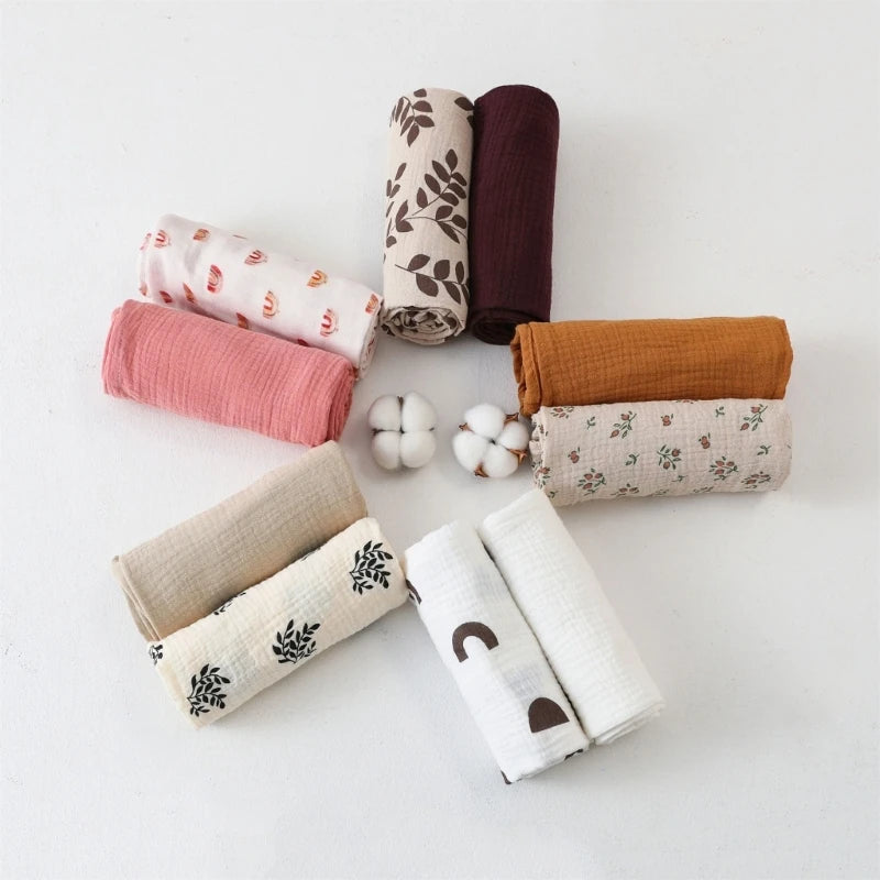 Soft I YAN cotton swaddle blanket for babies, featuring a solid color and floral print in crinkle muslin fabric, ideal for newborns.