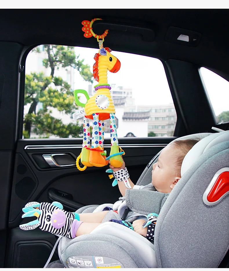 Soft plush giraffe and zebra handbells and rattles for infants, featuring teething handles, suitable for newborn baby development.