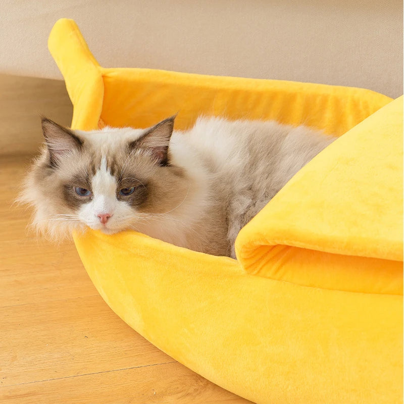 Colorful banana-shaped cat bed by I YAN with cozy, durable fabric, perfect for cats and small pets as a warm, portable pet house.