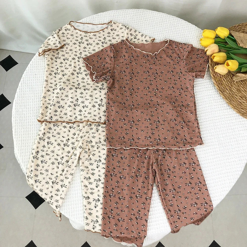 Kids casual summer clothing set by I YAN featuring a bear-themed floral printed short sleeve T-shirt and matching pants.